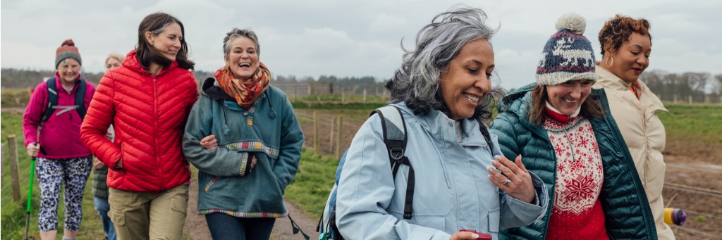 Group of women walking outdoors.